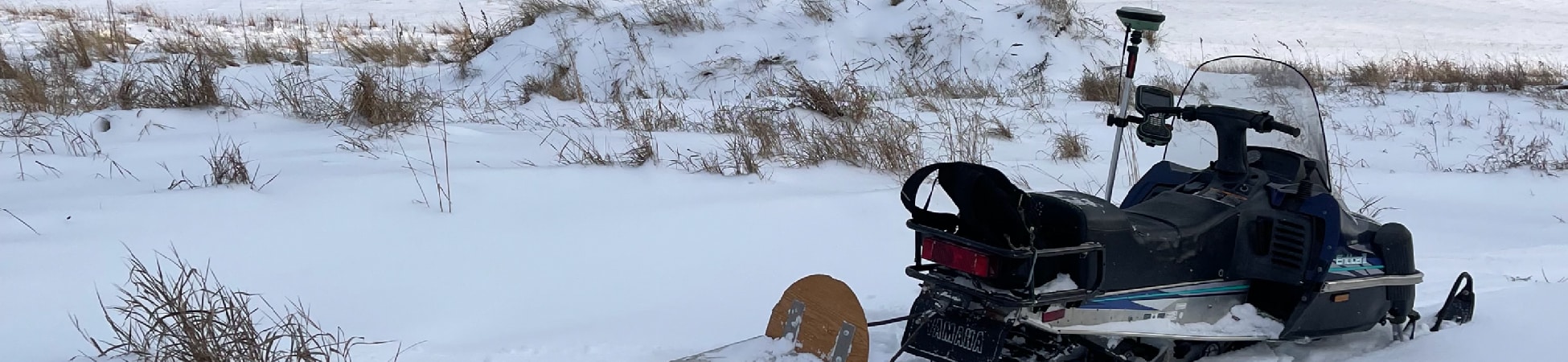 surveying in a field for a topographic survey in whitehorse yukon